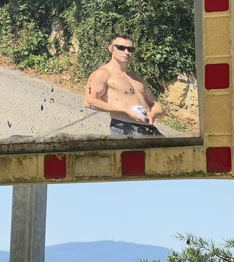Rok reflected in a roadside mirror.